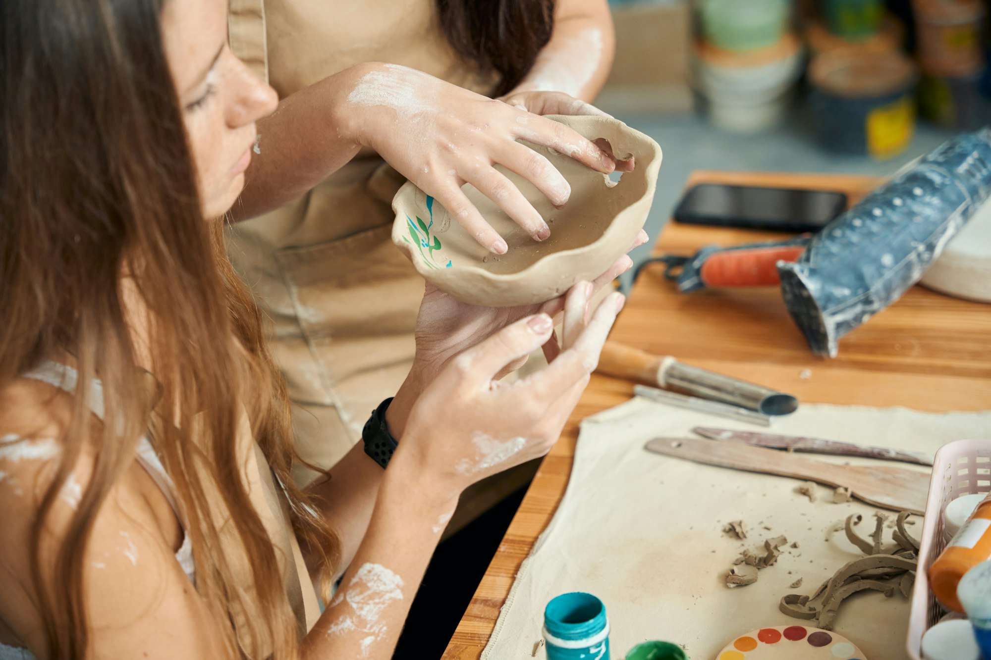 Potter women enjoying craft creative making handmade clay products