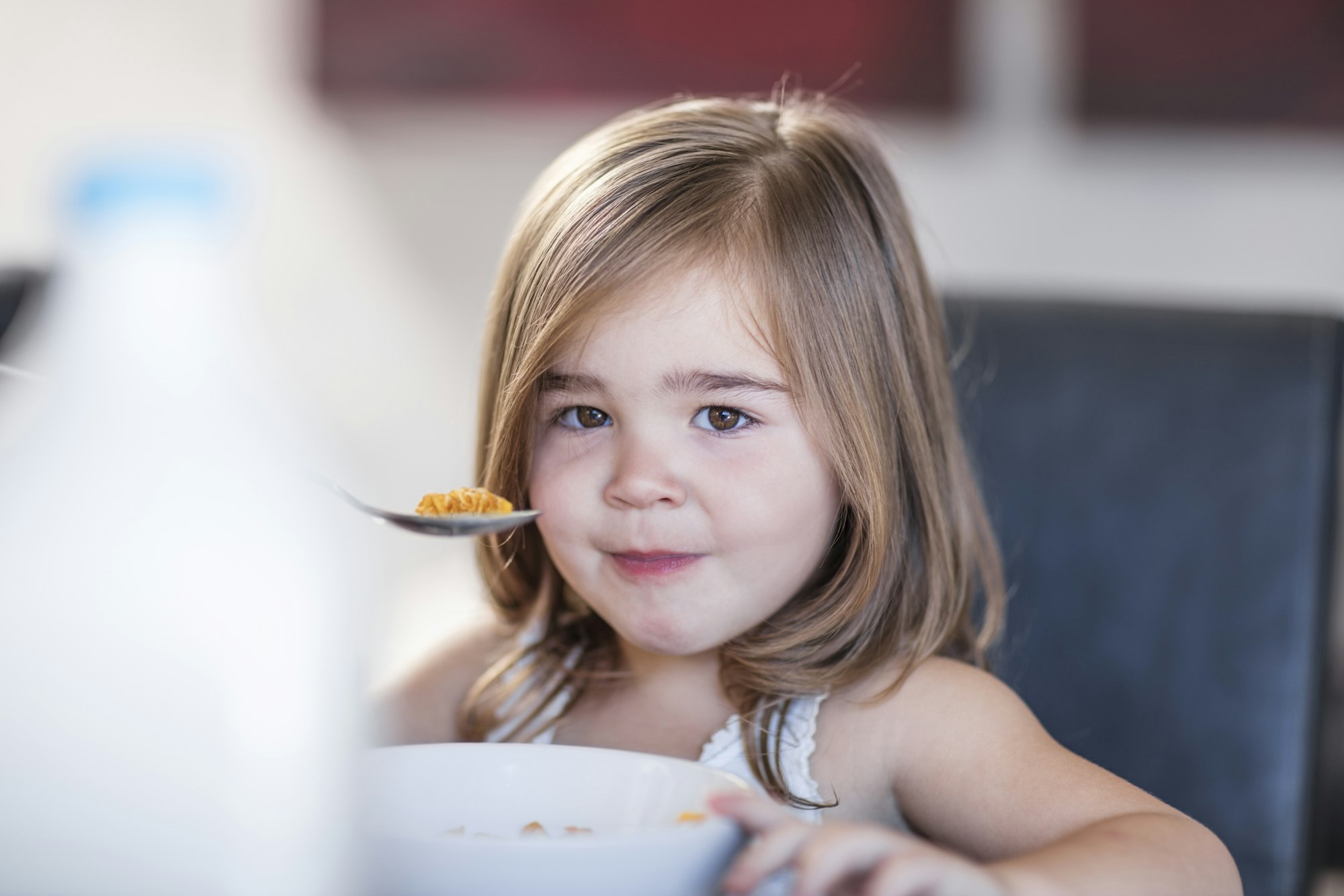 Portrait of toddler eating breakfast cereal